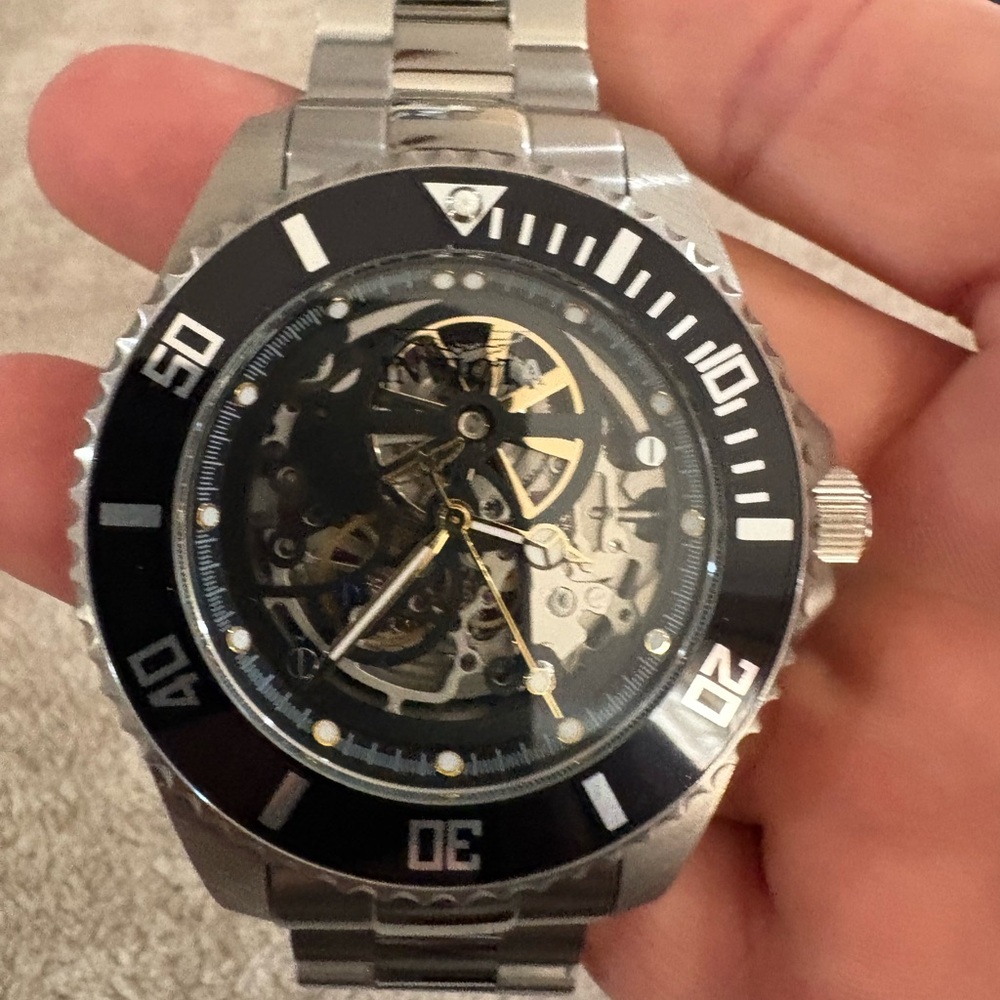 Invicta Silver and Black Skeleton Dial Watch